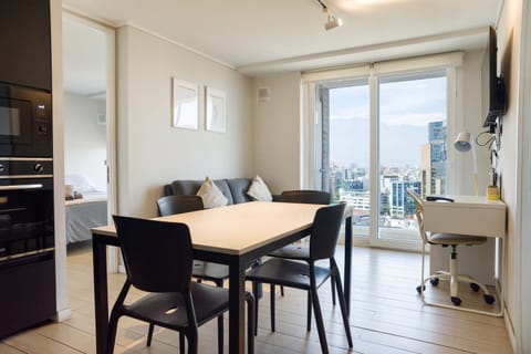 Bright and modern living space with stunning city views, perfect for relaxation or work.