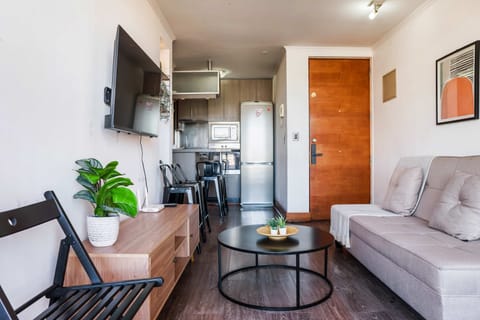 Cozy living area with modern amenities and a kitchenette, perfect for relaxing after exploring the city.