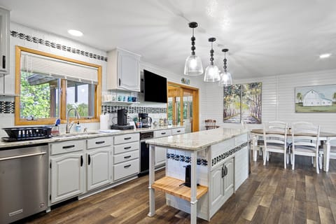 Full kitchen equipped with all essential cooking and eating needs.