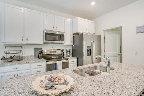 Gleaming Granite Countertops and Stainless Appliances.