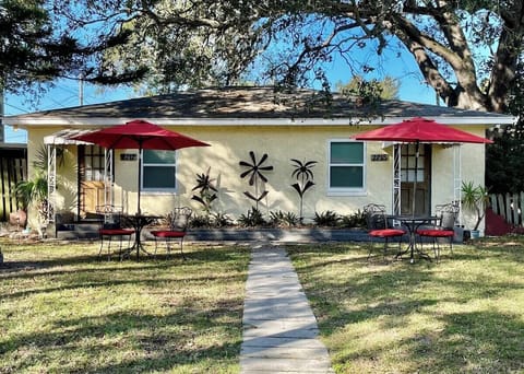 Charming duplex cottage with fun metal art. 