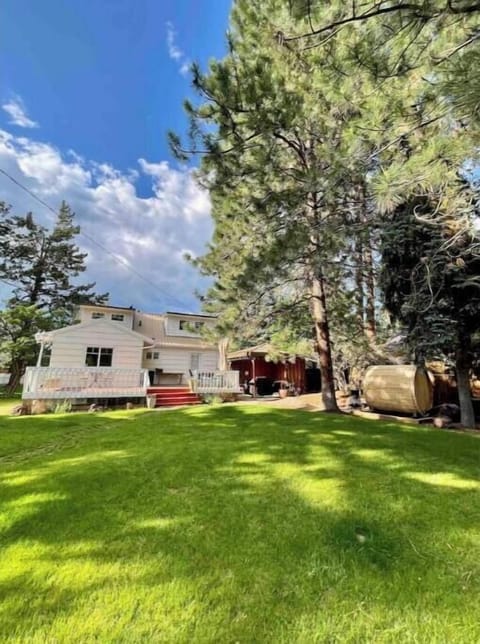Beautiful, fully fenced yard in a serene setting. Surrounded by old-growth pines