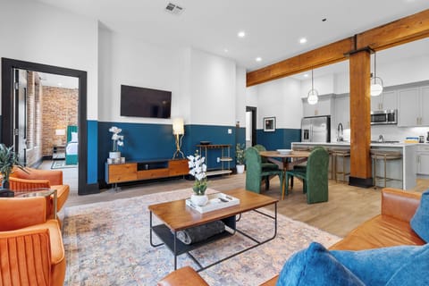Relax in the living area with a smart TV, stylish seating, and a sleeper sofa for extra guests. Perfect for families or group stays in New Orleans, this inviting space is ideal for movie nights or recharging after a day in the city.