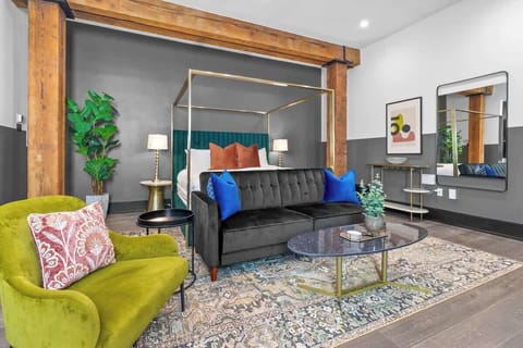 Relax in the living area with a smart TV, stylish seating, and a sleeper sofa for extra guests. Perfect for families or group stays in New Orleans, this inviting space is ideal for movie nights or recharging after a day in the city.