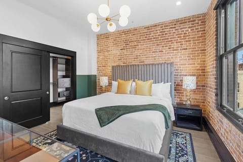 Retreat to the Primary bedroom with a plush king bed, walk-in closet, blackout shades, and a smart TV. Designed for comfort and privacy, this suite is perfect for recharging after a day exploring New Orleans.