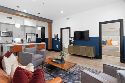 Relax in the living area with a smart TV, stylish seating, and a sleeper sofa for extra guests. Perfect for families or group stays in New Orleans, this inviting space is ideal for movie nights or recharging after a day in the city.