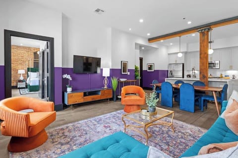 Relax in the living area with a smart TV, stylish seating, and a sleeper sofa for extra guests. Perfect for families or group stays in New Orleans, this inviting space is ideal for movie nights or recharging after a day in the city.