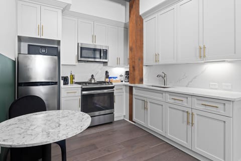 Cook or snack in style with a full kitchen featuring GE stainless appliances, cookware, and a dining area with two seating. Ideal for short or extended stays, our kitchens make group travel in New Orleans easy and comfortable.