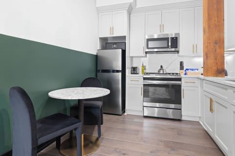 Cook or snack in style with a full kitchen featuring GE stainless appliances, cookware, and an island with bar seating. Ideal for short or extended stays, our kitchens make group travel in New Orleans easy and comfortable.