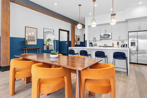 Enjoy meals together at your in-suite dining table with seating for your group. Whether it's takeout, delivery, or a home-cooked meal, this cozy dining area makes every stay at 888 Baronne feel like home in New Orleans.