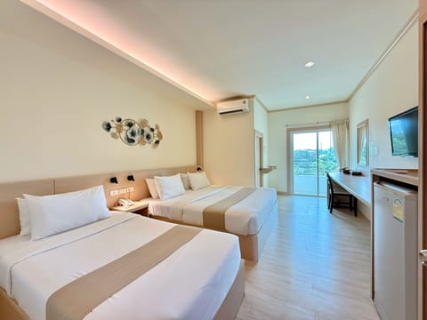 Deluxe Twin Room, City View | Individually decorated, desk, laptop workspace, blackout drapes