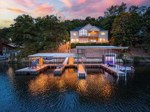 Welcome to your HUGE private dock! Fully equip with a slide, lily pad, kayaks, paddle boat, fishing poles and lounge chairs. Rent a boat with a wave runners and tie them up to this dock during your stay! The largest slip is a 16x36