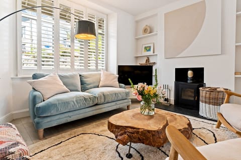 The living room with a log burner, smart TV, board games and sociable seating.