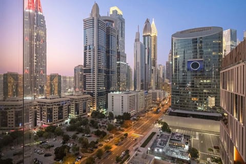 City View: Marvel at stunning skyline views from your window as the sun sets over Dubai!
