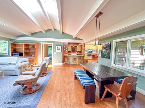 Living room opens to dining and kitchen areas