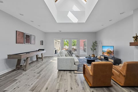 This space is all about relaxation and fun, from cozy couches to game-ready shuffleboard.