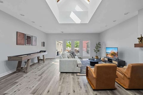 This space is all about relaxation and fun, from cozy couches to game-ready shuffleboard.