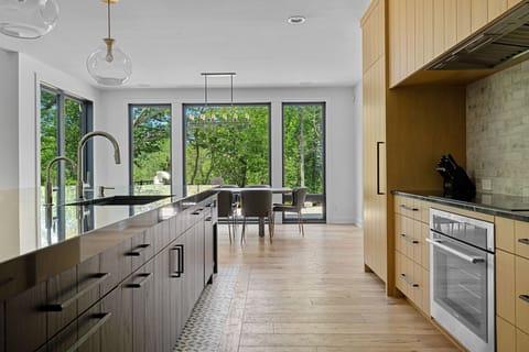 Inviting kitchen with a stunning island and charming wooden floors - the heart of the home.