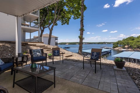 Relax on the serene patio with stunning lake views, perfect for unwinding and enjoying the peaceful surroundings.
