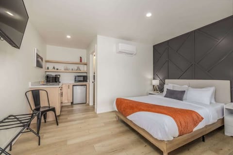 Queen sized bed with large tv 