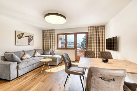 Relax in the living area with sofa and balcony view