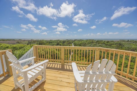 Step out onto the furnished deck and watch the sun’s waning golden rays dance across the water.