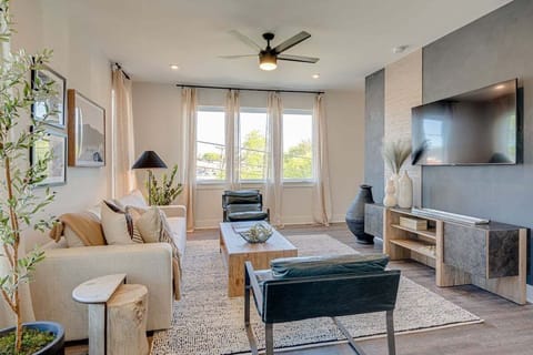 Light and Bright living room featuring flat-screen SMART TV and designer furnishings.