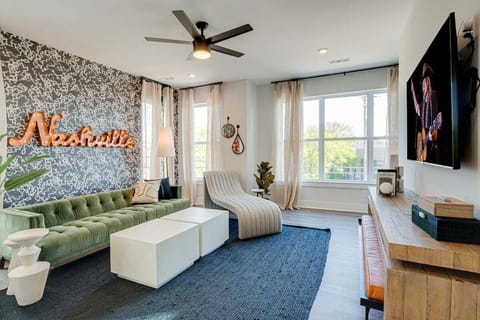 Bright and open living space complete with designer furnishings and smart TV.