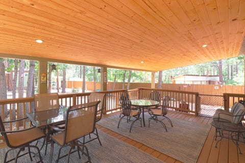Enjoy your morning coffee on the porch, with two tables and a two seat glider.