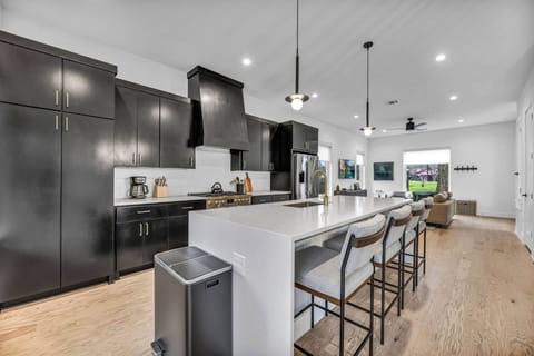 Get ready to eat with a large fully stocked kitchen including island with bar stool seating