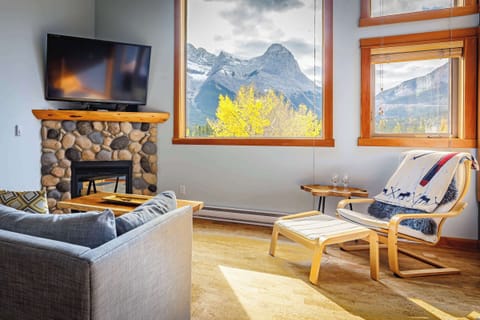 Cozy up by the stone gas fireplace, enjoy the views, and catch a movie