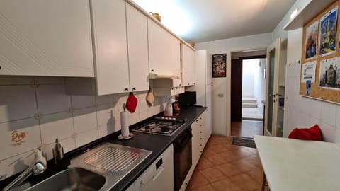 Meticulously clean kitchen: part of a sea view apartment in the center of Viareggio.