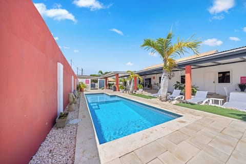 - Dive into the sparkling blue waters of our refreshing pool of the home in Oranjestad, Aruba - Experience the enchanting evening ambiance, with soft lighting illuminating the pool - Fire up the BBQ grill and enjoy poolside cookouts with loved ones