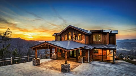Arrive to breathtaking sunset views at this luxury Smoky Mountain Cabin. 
