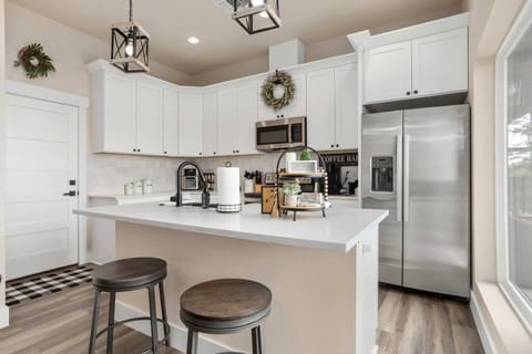The kitchen features quartz countertops and stainless-steel appliances.