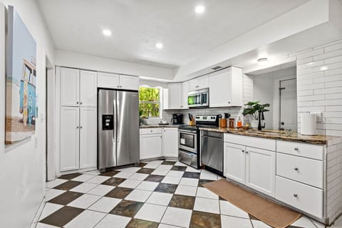 This spacious kitchen is fully equipped with modern appliances and plenty of counter space.