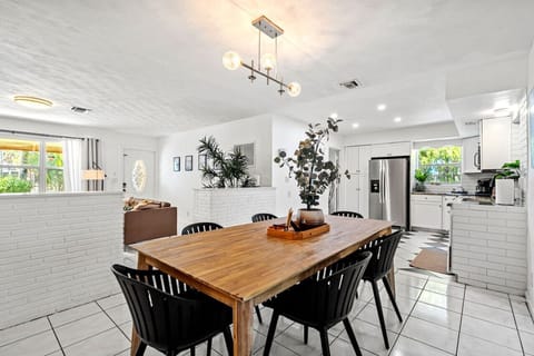 This open-concept dining and kitchen area is designed for gathering, cooking, and making memories. Plus, the game room adds a fun twist to your stay!