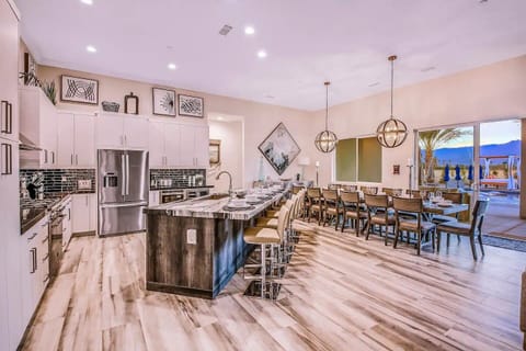 Stunning dual-purpose space connecting the gourmet kitchen to the expansive dining area.