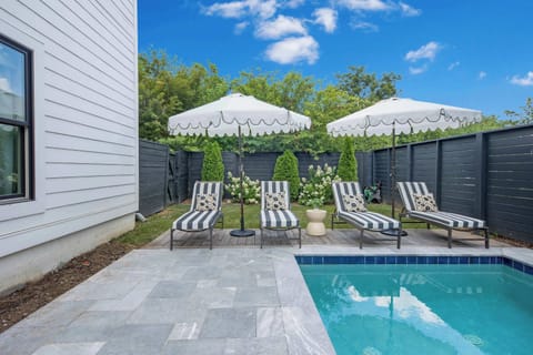 This spacious backyard oasis offers seating for the whole group—great for poolside hangs, casual conversations, or simply enjoying the peaceful neighborhood surroundings.