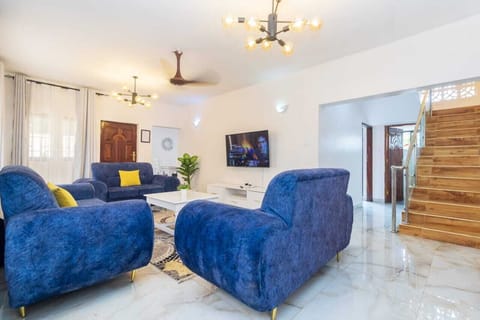 Family Villa | Living area | 24-inch Smart TV with digital channels