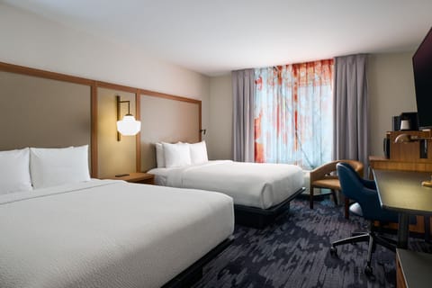 Select Comfort beds, desk, laptop workspace, blackout drapes