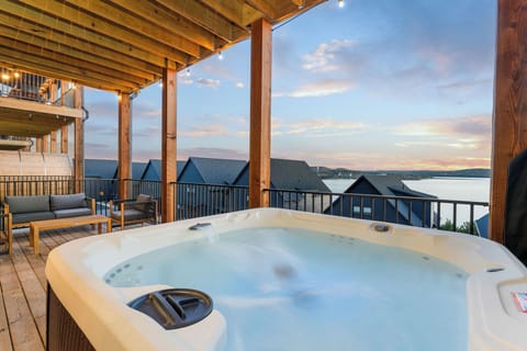 Relax outdoors on the deck with peaceful lake views while enjoying the private hot tub or warming up in the barrel sauna. It's the perfect spot to recharge and take in the scenery.
