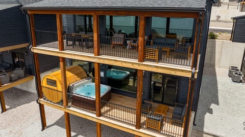 This lakeview deck offers the ultimate relaxation—hot tub, sauna, grill, and cozy seating all in one spot. Everything you need to relax!