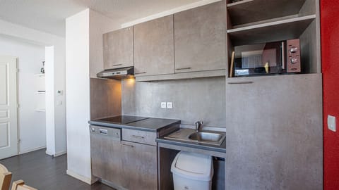 Curb your appetite by cooking a meal in your kitchenette.