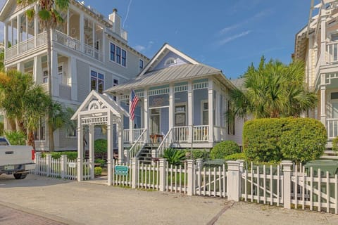Front view of the property with picket fence and porch