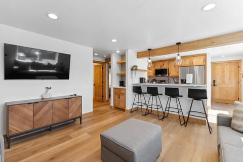 Open living room and kitchen with smart tv
