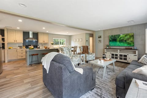 Modern style meets homey comfort. Our spacious living room features stylish seating, premium finishes, and a seamless flow into the kitchen—perfect for entertaining or unwinding after a day of exploring.