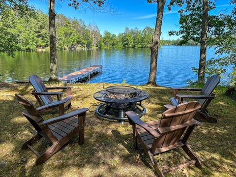 Enjoy serene evenings by Twin Bear Lake with a cozy fire pit, perfect for making s'mores and sharing stories under the stars.