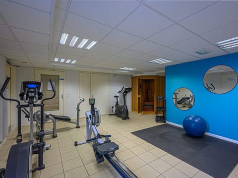 On-site fitness room with cardio equipment including an elliptical and rowing machine