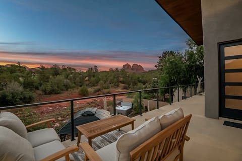 Sunset deck with stunning red rock views, cozy seating